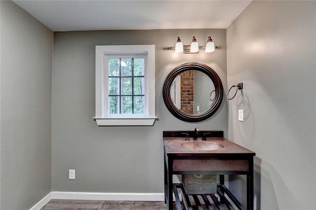 5507 Martina Way, Dunwoody, GA 30338 - bathroom with baseboards, vanity, and wood finished floors