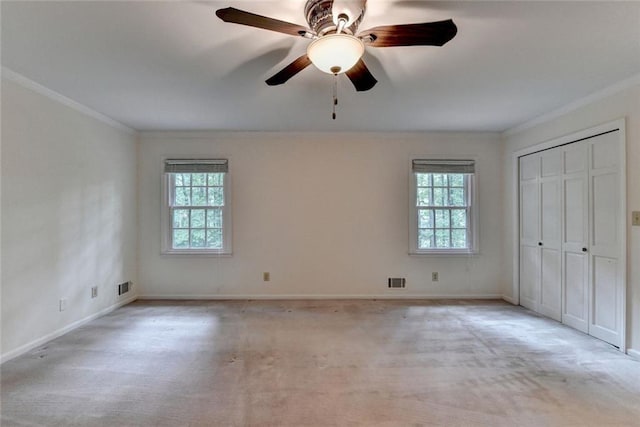 5507 Martina Way, Dunwoody, GA 30338 - unfurnished bedroom featuring ornamental molding, light carpet, baseboards, a ceiling fan, and a closet