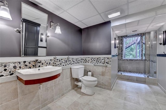 5507 Martina Way, Dunwoody, GA 30338 - full bath with toilet, a stall shower, a paneled ceiling, tile patterned flooring, and a sink