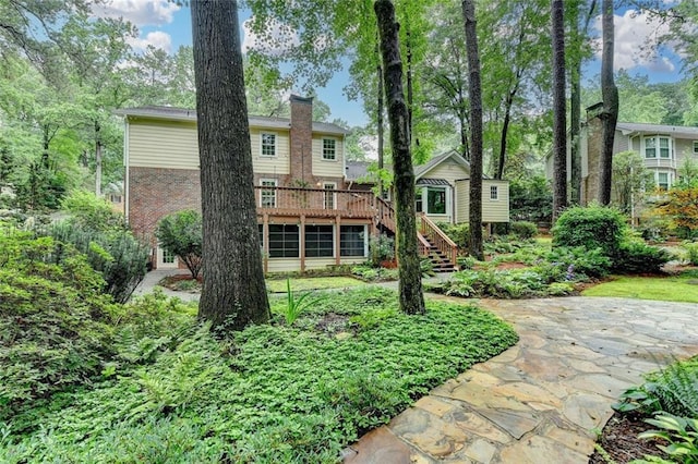 5507 Martina Way, Dunwoody, GA 30338 - rear view of property with stairway, a wooden deck, brick siding, and a chimney