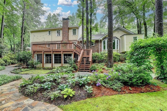 5507 Martina Way, Dunwoody, GA 30338 - back of house with stairs, a deck, a chimney, and brick siding