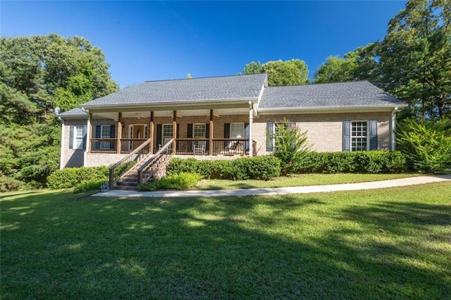 view of front of house featuring a front lawn and covered porch