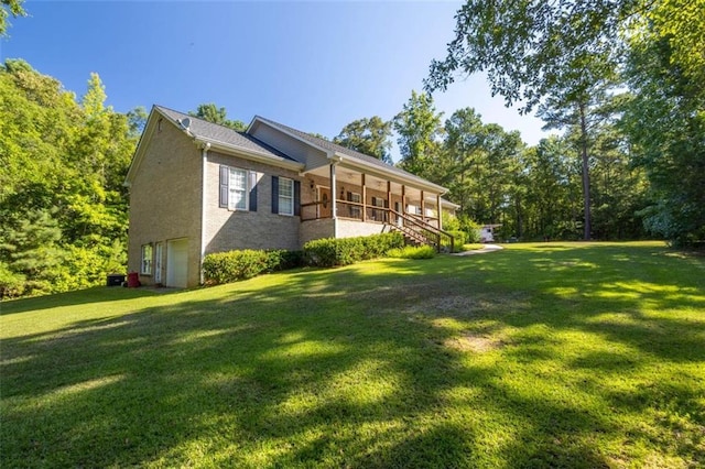 view of property exterior featuring a sunroom and a lawn