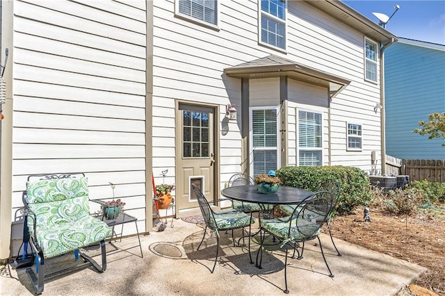 view of patio / terrace featuring outdoor dining space and fence