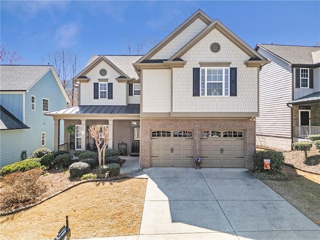 view of front of property featuring brick siding, an attached garage, metal roof, driveway, and a standing seam roof