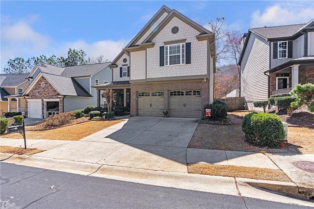 view of front of home featuring brick siding, driveway, and an attached garage