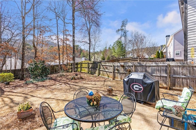 view of patio / terrace with area for grilling and a fenced backyard