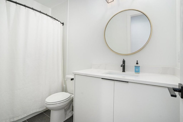 full bathroom with vanity, toilet, and tile patterned floors