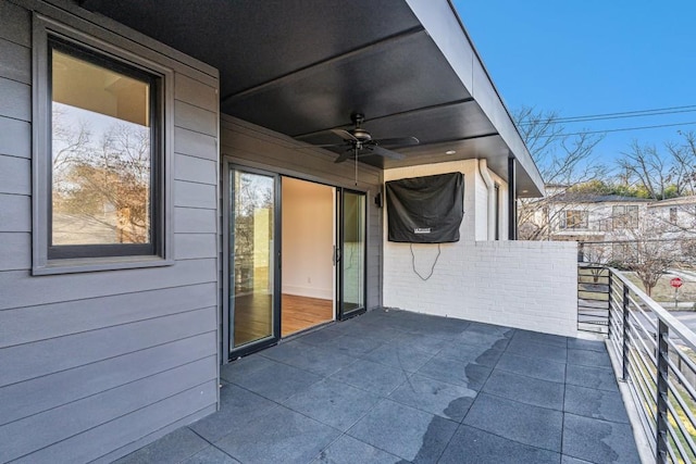 view of patio featuring a balcony and ceiling fan