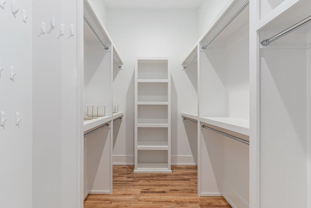 spacious closet with light wood-style floors