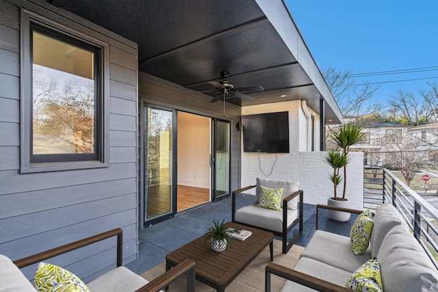 exterior space featuring a ceiling fan, an outdoor living space, and a balcony