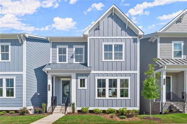 1941 Quarry Park Pl NW, Atlanta, GA 30318 - view of front of home featuring board and batten siding, a standing seam roof, and metal roof