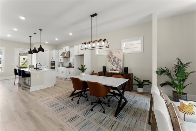 1941 Quarry Park Pl NW, Atlanta, GA 30318 - dining room featuring light wood-type flooring, recessed lighting, and baseboards