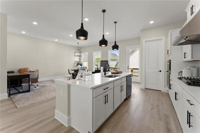 1941 Quarry Park Pl NW, Atlanta, GA 30318 - kitchen featuring ventilation hood, a sink, dishwasher, black gas cooktop, and light countertops