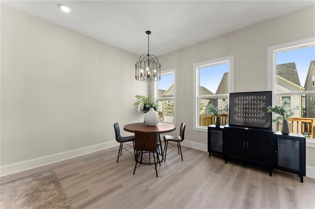 1941 Quarry Park Pl NW, Atlanta, GA 30318 - dining room with light wood finished floors, a chandelier, baseboards, and recessed lighting