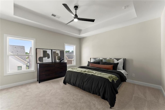 1941 Quarry Park Pl NW, Atlanta, GA 30318 - bedroom featuring a raised ceiling, light colored carpet, baseboards, and a ceiling fan