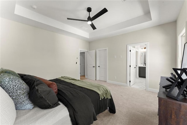 1941 Quarry Park Pl NW, Atlanta, GA 30318 - bedroom with a tray ceiling, carpet floors, baseboards, ceiling fan, and ensuite bathroom