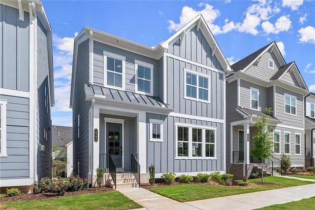 1941 Quarry Park Pl NW, Atlanta, GA 30318 - view of front of house featuring board and batten siding, a standing seam roof, metal roof, and a front yard