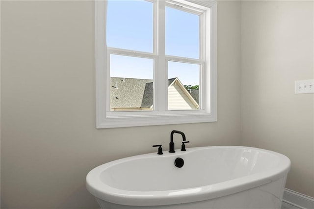 1941 Quarry Park Pl NW, Atlanta, GA 30318 - full bathroom featuring a freestanding tub and baseboards