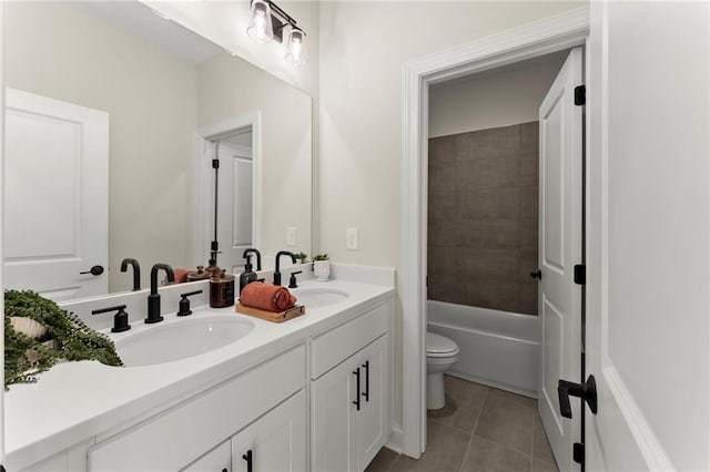 1941 Quarry Park Pl NW, Atlanta, GA 30318 - bathroom featuring double vanity, toilet, and tile patterned flooring