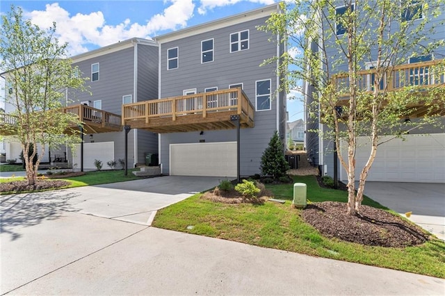 1941 Quarry Park Pl NW, Atlanta, GA 30318 - view of front of house featuring an attached garage, driveway, and a front lawn