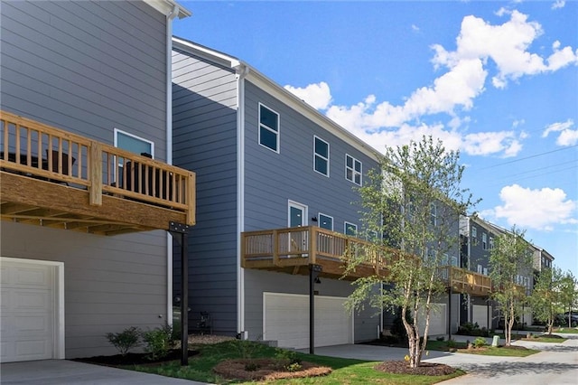 1941 Quarry Park Pl NW, Atlanta, GA 30318 - rear view of house with an attached garage and a balcony