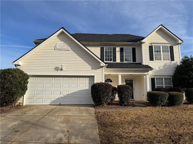 front of property with a garage