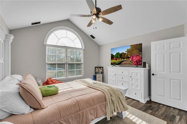 bedroom featuring ceiling fan, dark hardwood / wood-style flooring, and vaulted ceiling