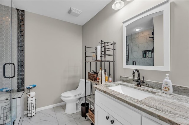 bathroom with vanity, toilet, and walk in shower