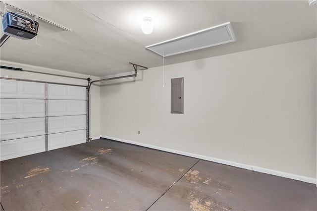 garage with a garage door opener and electric panel