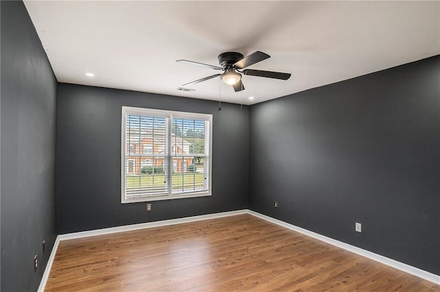 unfurnished room featuring ceiling fan and wood-type flooring