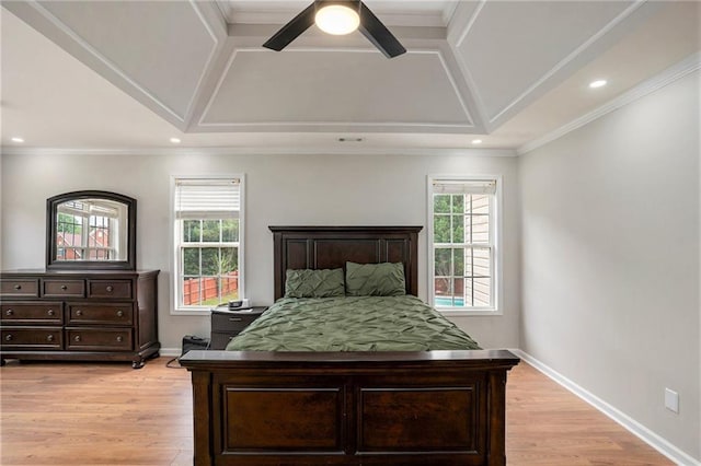 bedroom featuring light hardwood / wood-style floors, ceiling fan, and ornamental molding