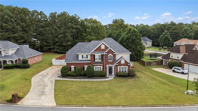 view of front of property with central AC unit and a front lawn