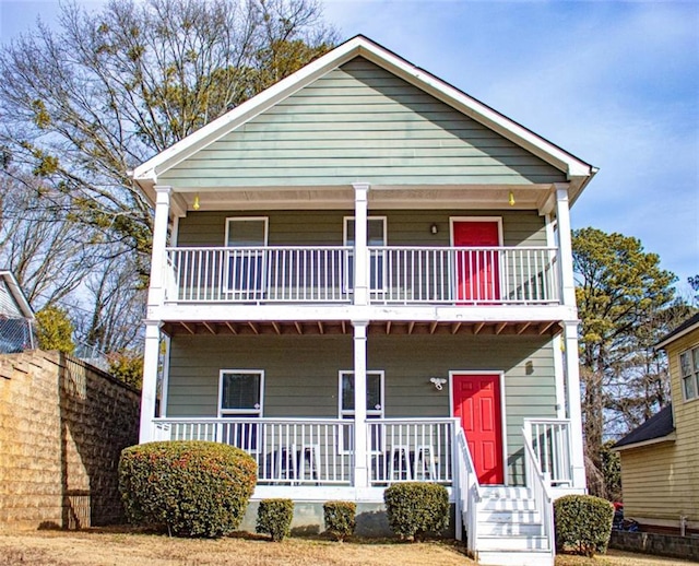 view of front of home with a balcony and covered porch