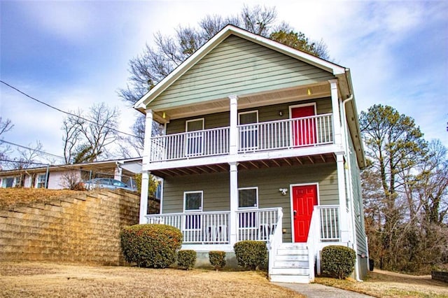 view of front facade with a porch and a balcony