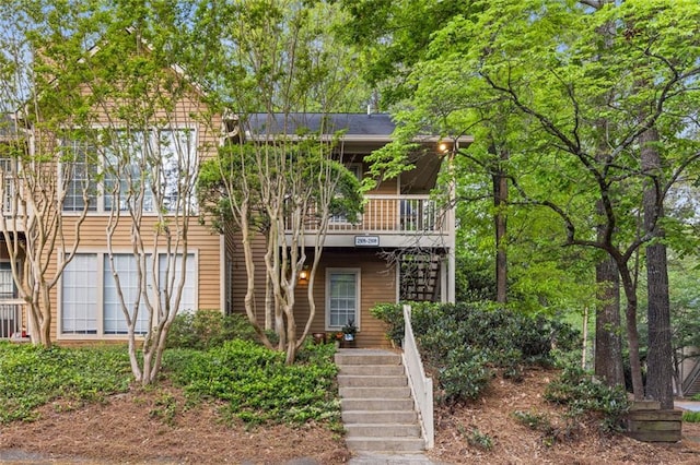 view of front of property with stairs