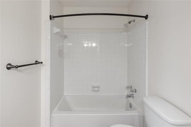 bathroom with toilet and tub / shower combination