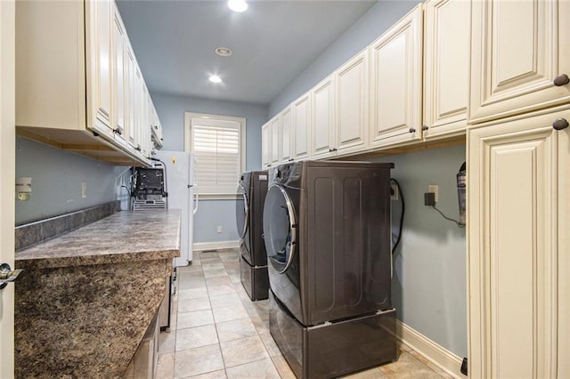 laundry room featuring separate washer and dryer, light tile patterned flooring, recessed lighting, and baseboards