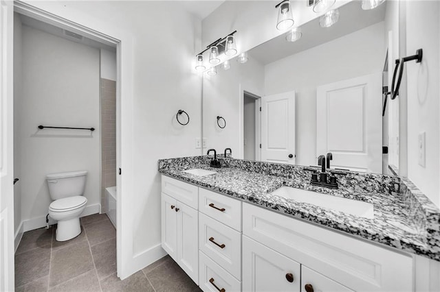 1664 Crestridge Dr SE, Marietta, GA 30067 - bathroom featuring double vanity, toilet, baseboards, and tile patterned floors