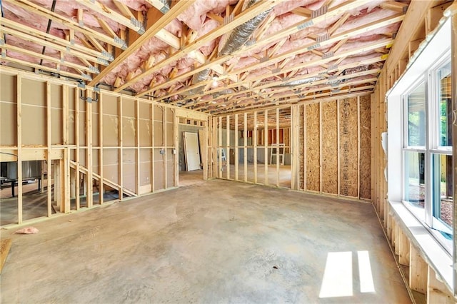 1664 Crestridge Dr SE, Marietta, GA 30067 - miscellaneous room featuring plenty of natural light and concrete floors