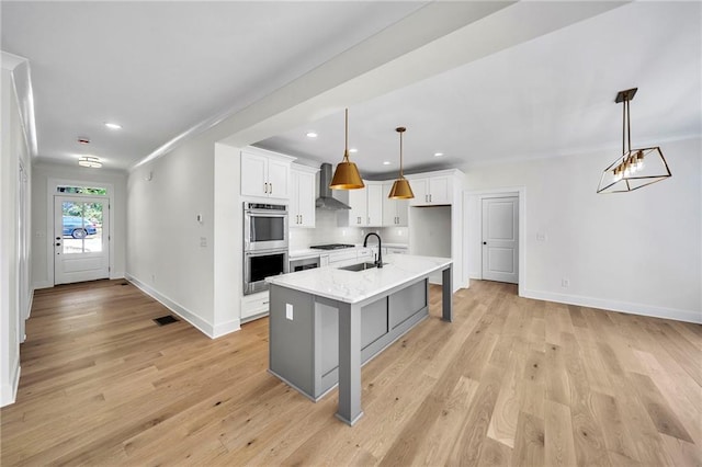 1664 Crestridge Dr SE, Marietta, GA 30067 - kitchen with a sink, stainless steel double oven, baseboards, light wood finished floors, and white cabinets