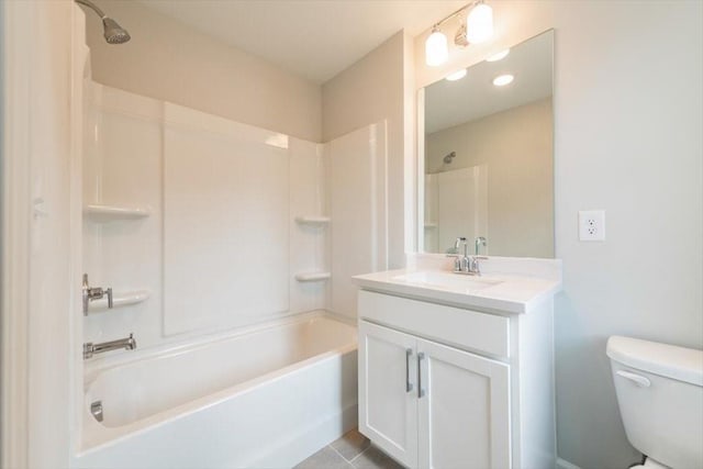 full bathroom with tile patterned floors, toilet, vanity, and shower / tub combination