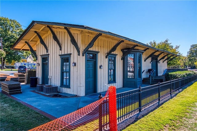 view of front of property with a fenced front yard and board and batten siding