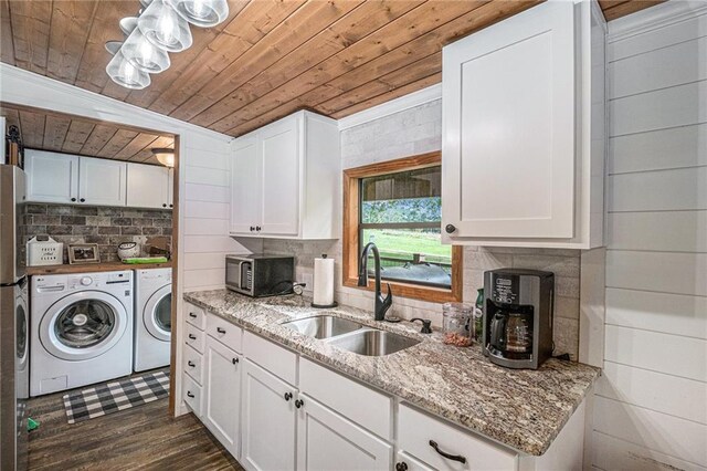 370 David Williams Rd, Sparta, GA 31087 - kitchen with washer and dryer, white cabinets, a sink, stainless steel microwave, and wooden ceiling