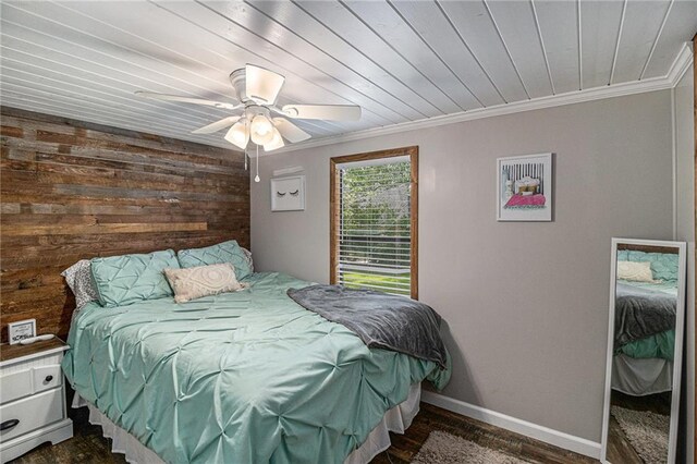 370 David Williams Rd, Sparta, GA 31087 - bedroom featuring dark wood-type flooring, ornamental molding, baseboards, and wooden walls