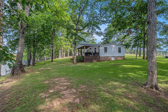 370 David Williams Rd, Sparta, GA 31087 - view of yard with a wooden deck