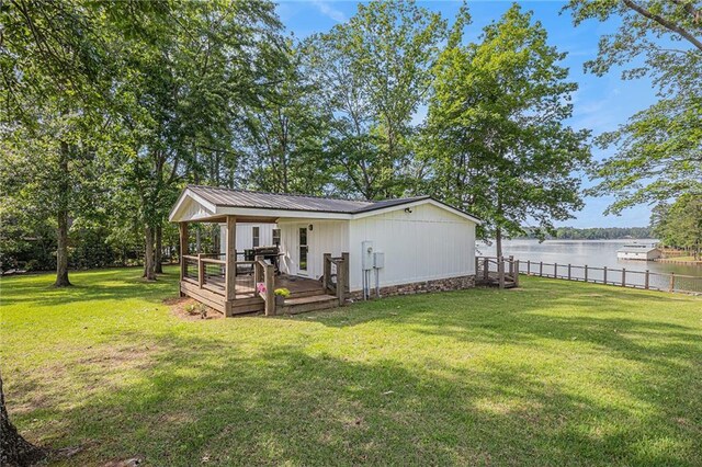 370 David Williams Rd, Sparta, GA 31087 - view of yard with fence and a deck with water view