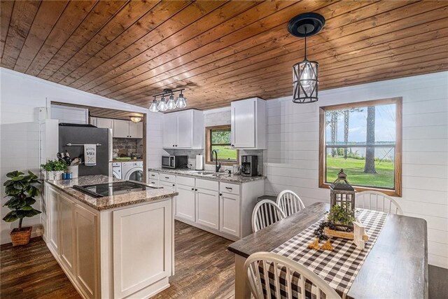 370 David Williams Rd, Sparta, GA 31087 - kitchen with wood ceiling, stainless steel microwave, white cabinetry, a sink, and dark wood finished floors