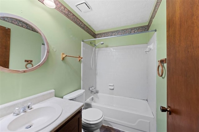 full bathroom with a textured ceiling, vanity, toilet, and tub / shower combination