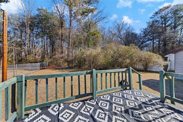 wooden terrace with a yard